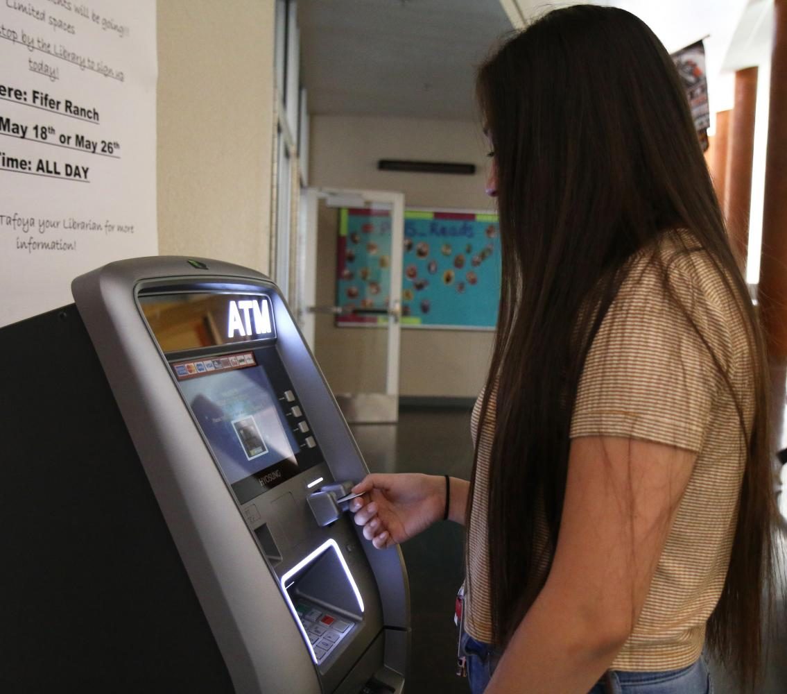 Junior Kaylah Rodriguez visits the ATM during lunch.