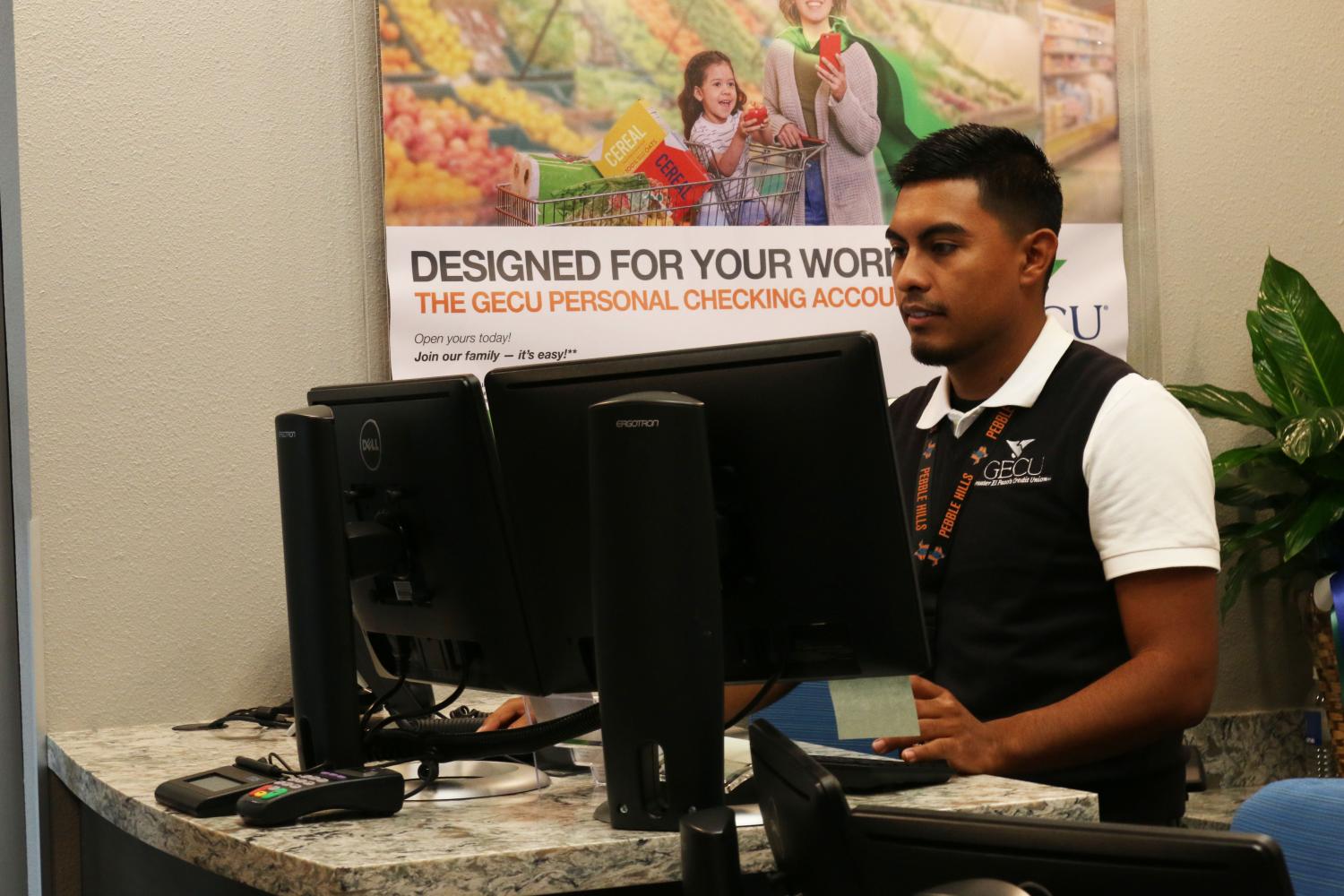 Relationship officer Daniel Velasquez is ready to assist students at the new GECU branch located in front of the library. 