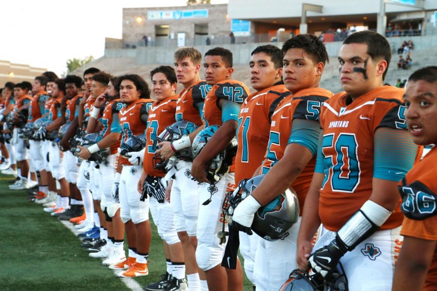 Spartans line up for the national anthem before their game against Andress Sept. 7 at the SAC.