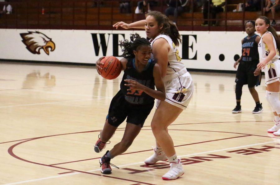 Junior Trinity Anderson drives by Andress defender Nov. 7 in the first half.