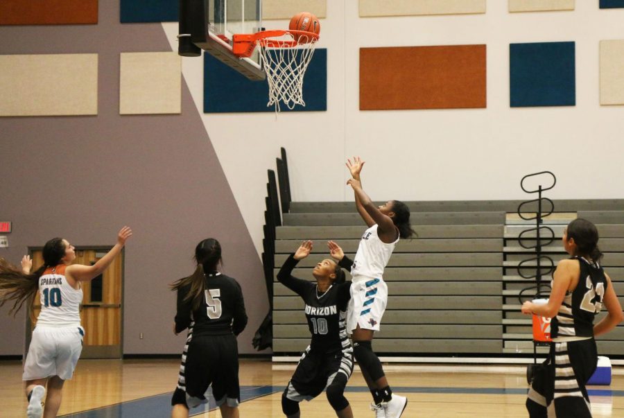 Jimiyah Stewart attacks the zone and scores in the second half. Spartans defeated the Scorpions 63-36.