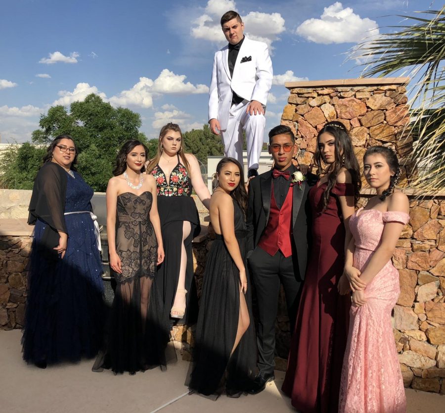 Students pose for a picture right before heading out to prom Saturday night, April 28. The AV production students went together.