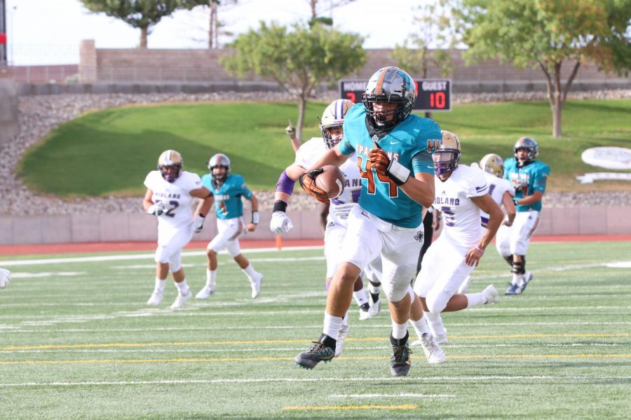 Sophomore Devean Deal catches a pass from junior Sebastian Ochoa for a 23-yard touchdown en route to the Spartans 42-38 win against Midland Sept. 6 at the SAC.