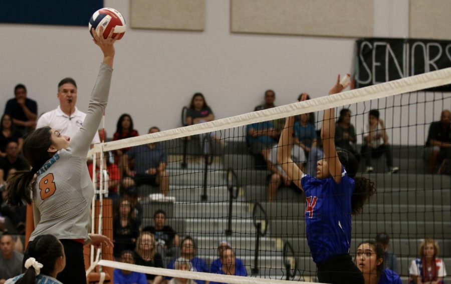 Junior Amaris Vazquez goes up and attempts to collect a kill for the Spartans in their district match against Americas Friday afternoon Sept. 28. The Spartans lost in four sets.