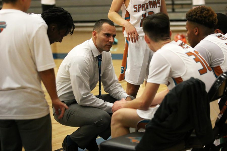 Head coach Arturo Escobar calls a timeout during the first quarter of Tuesdays game against the Bowie Bears. The Spartans defeated the Bears, 64-62.