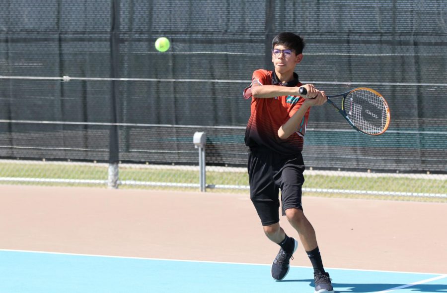 Freshman Jaime Vega returns the ball in the dual match against Socorro Friday afternoon Sept. 17. Photo by Ariani Kirtley-Anaya 