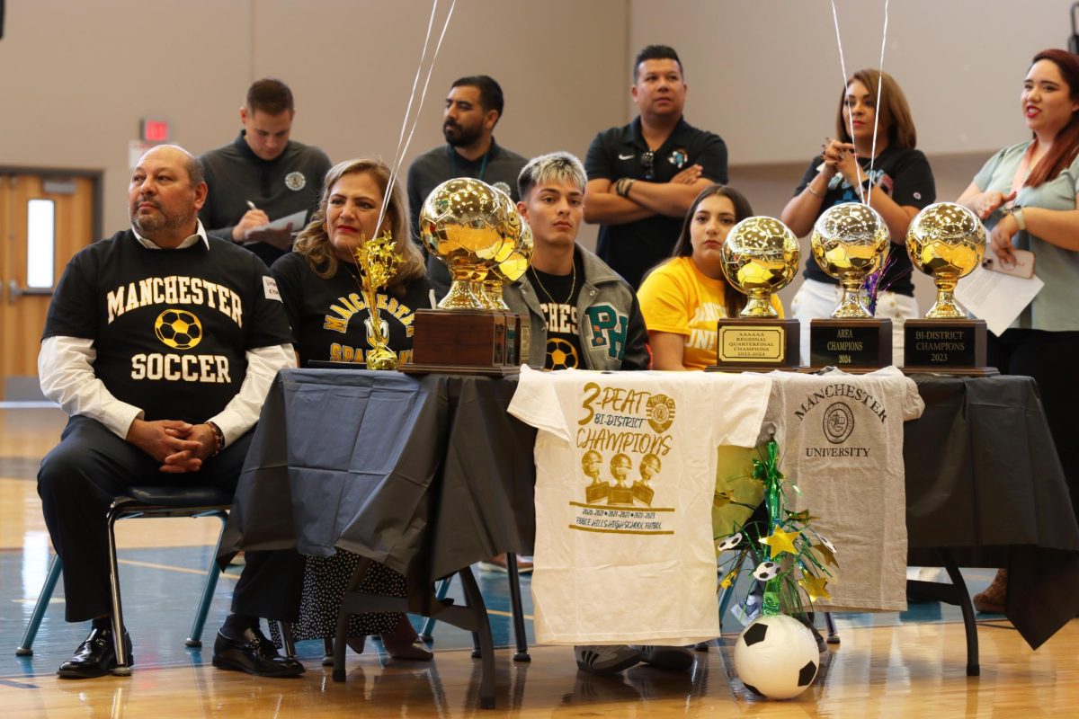 Senior Brian Lira with his family during senior signing Thursday May 9.