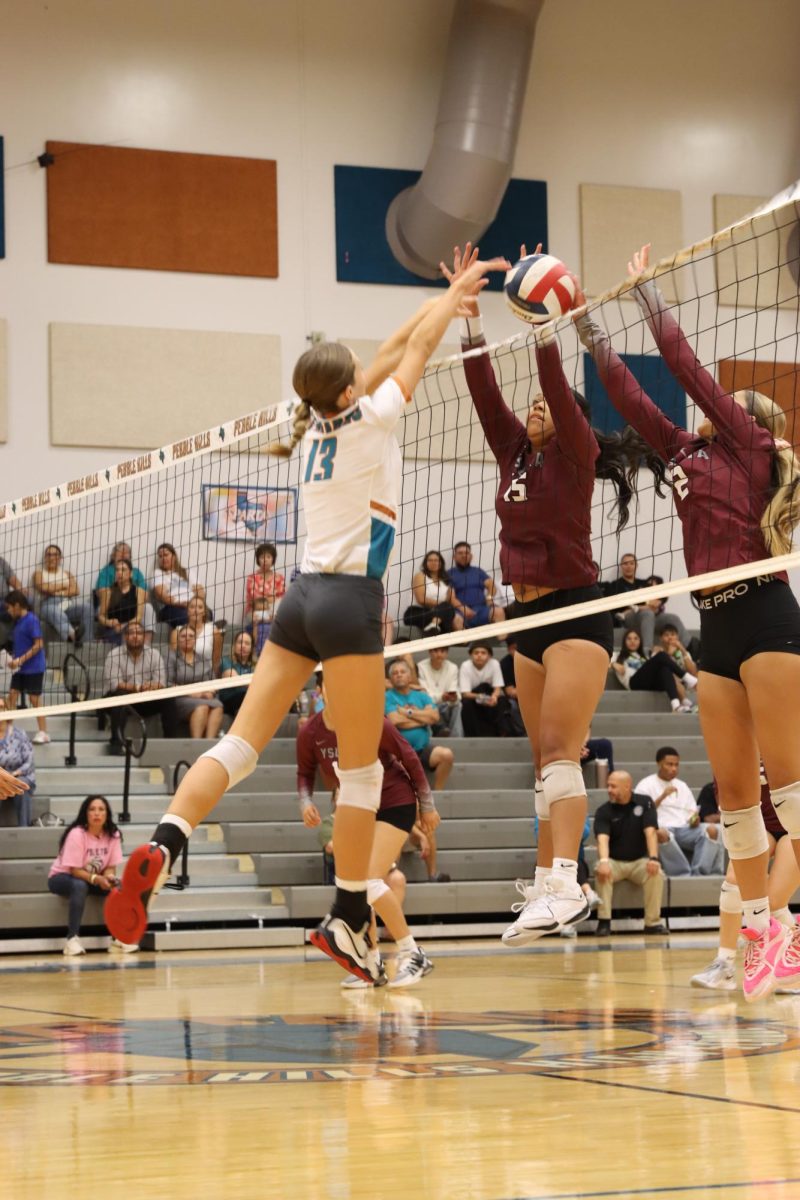 Freshman Addison Pollock goes for a kill during the first set against the Ysleta Indians Tuesday night Aug. 20. Photo by Madeline Trejo