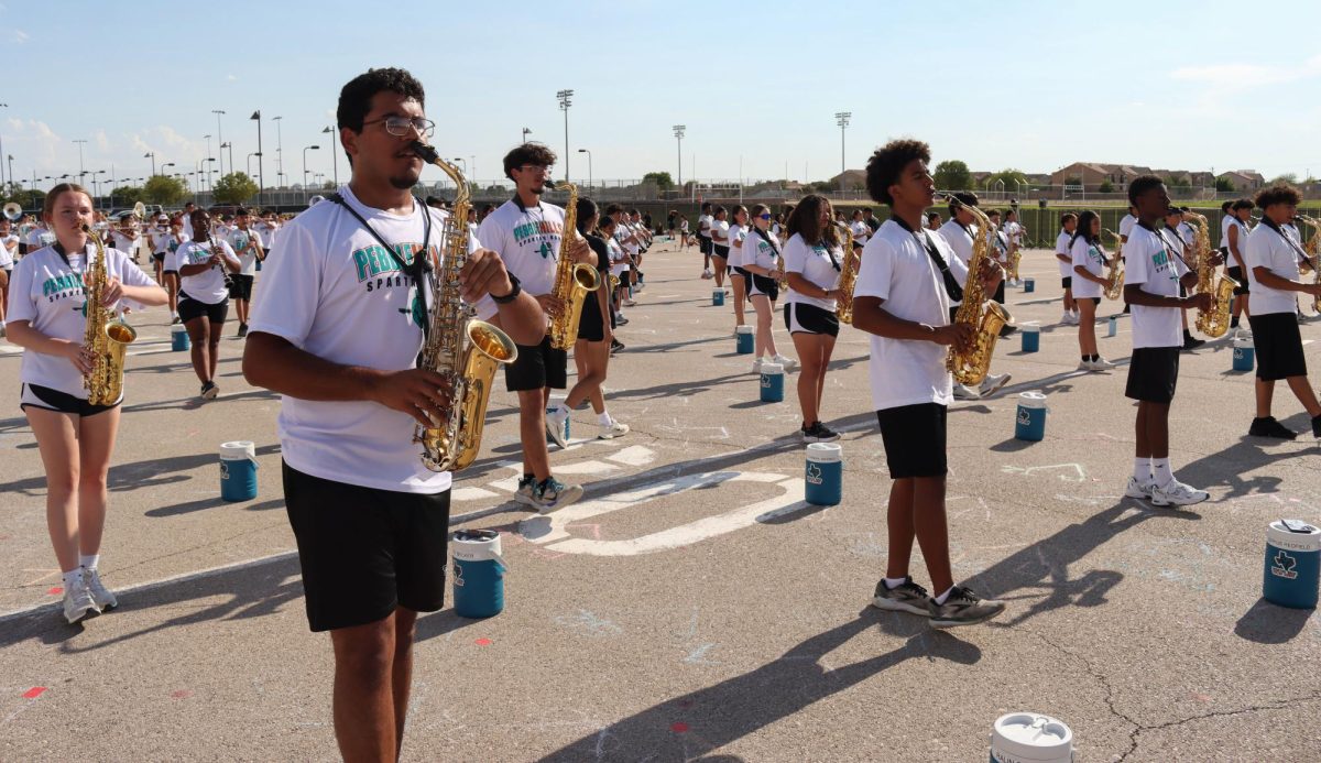 Senior Diego Baltier and the band practice Tuesday afternoon, Aug. 12. Photo by Shaila Garcia 